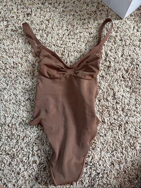 SKIMS brown ribbed one-piece bodysuit